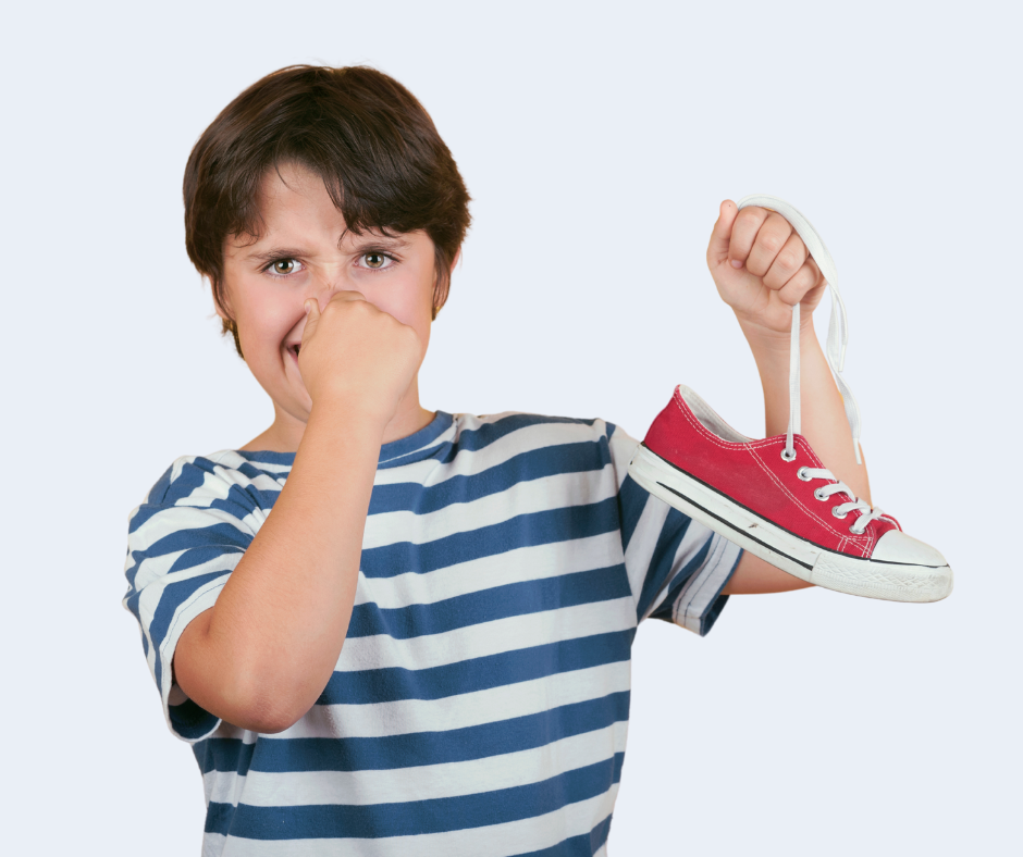 Kid holding smelly red sneaker
